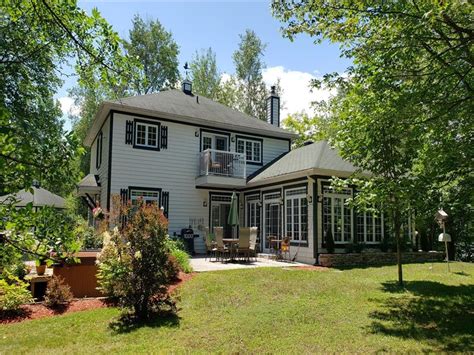 Magog chalet rental  Guests can enjoy a private, impeccable neighbourhood beach with a park